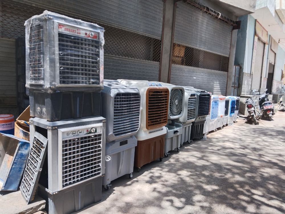 MK steel furniture ke iron aur plastic coolers dukaan ke bahar