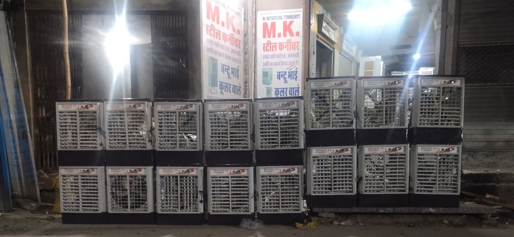 M.K. steel furniture ki dukaan aur bahar rakhe coolers